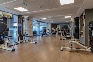 a gym with several treadmills and tread machines at Flat à beira-mar Solar Tambaú - MyFlats in Tambaú