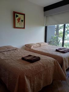 Ένα ή περισσότερα κρεβάτια σε δωμάτιο στο Apartamento en Kanajuyu