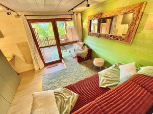 a bedroom with a large bed in a house at L écrin vosgien in La Bresse