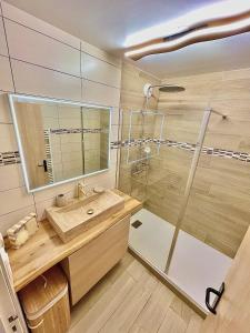 a bathroom with a sink and a shower at L écrin vosgien in La Bresse +24 photos