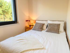 Postel nebo postele na pokoji v ubytování Borowikova Bałtycka Oaza Basen Sauna Jacuzzi + 12 fotografií