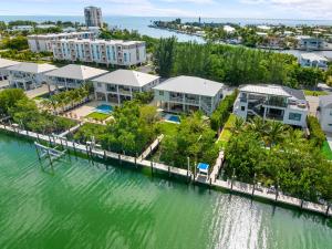 an aerial view of a resort on the water at Emerald Oasis Deluxe Waterfront Gem, Heated Pool with Dock in Marathon