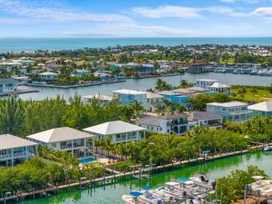 an aerial view of a marina with condos at Emerald Oasis Deluxe Waterfront Gem, Heated Pool with Dock in Marathon