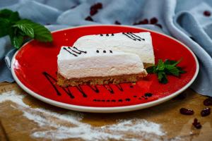 two pieces of cake on a red plate at Hotel Osam - Adults Only in Supetar