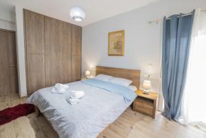 Postel nebo postele na pokoji v ubytování The Garden House Trikala