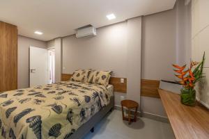 En eller flere senge i et værelse på Luxo e Tranquilidade na Ponta do Mutá-Pé na areia