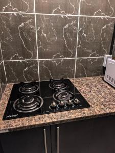 a stove top oven sitting on top of a counter at The Good Samaritan 3 in Witbank
