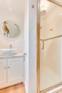 a bathroom with a sink and a shower at Pheasant Lodge in Reepham
