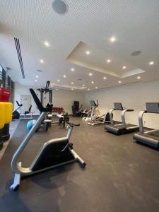 a gym with several cardio machines in a room at قرية الراحه مرسى زايد in Al Burj