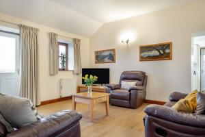 a living room with two couches and a table at 3 Bed in Whitwell oc-h33498 in Whitwell