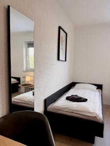 Postel nebo postele na pokoji v ubytování Pension Bockenem GbR + 1 fotografie