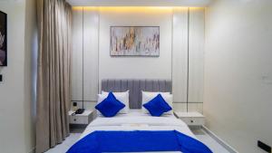 Ένα ή περισσότερα κρεβάτια σε δωμάτιο στο Luxury Apartments & Homes +117 φωτογραφίες