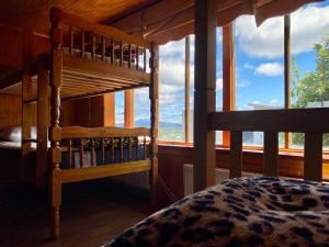 Ένα ή περισσότερα κρεβάτια σε δωμάτιο στο Hostel Patagonia Backpackers