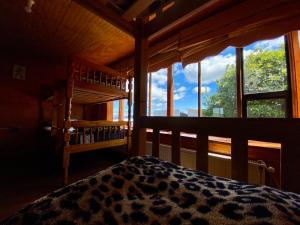 Ένα ή περισσότερα κρεβάτια σε δωμάτιο στο Hostel Patagonia Backpackers