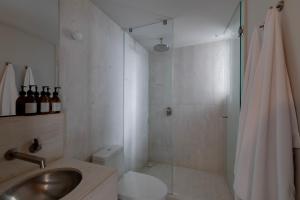 a bathroom with a shower and a sink and a shower at Capitalia Reforma Chapultepec in Mexico City +29 photos