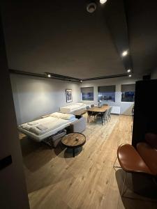 a hospital room with a bed and a table at Modern Apartment With Hot Tub in Akureyri in Akureyri +15 photos