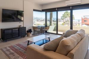 a living room with a couch and a table at The Point At Cerritos # 4 in San Carlos