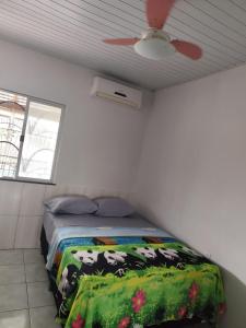 Ένα ή περισσότερα κρεβάτια σε δωμάτιο στο Casa Encanto Belém