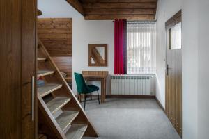 a room with stairs and a desk and a window at Magdalenka 5 min pieszo od Kotelnicy in Białka Tatrzanska