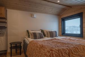 En eller flere senge i et værelse på Boreal Villa Kilpisjärvi