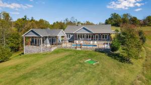 an aerial view of a house with a yard at Calaboose Retreat in Campton