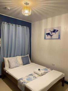 Ένα ή περισσότερα κρεβάτια σε δωμάτιο στο Blue Water De Santorini