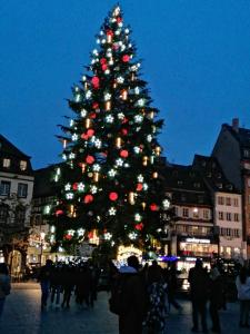 a christmas tree in the middle of a city at Hébergement 4 personnes proche centre ville Strasbourg in Strasbourg