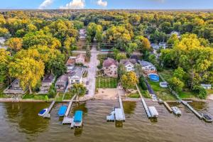 an aerial view of a house on the water at The Main Stay - Mineola Bay Lakeview and Access - Fully Furnished Monthly & Seasonal Rental in Fox Lake in Fox Lake