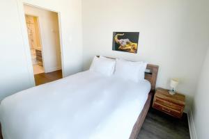 Ένα ή περισσότερα κρεβάτια σε δωμάτιο στο Corporate Stays Monarc 2 Bedroom