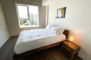 Ένα ή περισσότερα κρεβάτια σε δωμάτιο στο Corporate Stays Monarc 2 Bedroom +19 φωτογραφίες