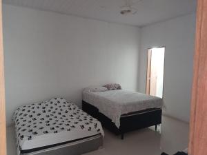 Postel nebo postele na pokoji v ubytování Chácara Velho Chico - in the city - near the river