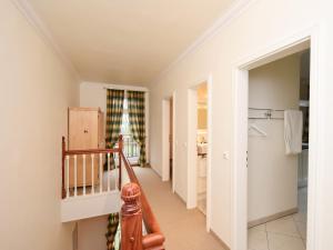 a hallway with a staircase in a house at Ferienwohnung Parkblick in Poseritz