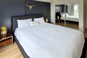 En eller flere senge i et værelse på Corporate Stays Blum 1 Bedroom