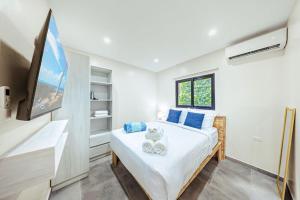 Ένα ή περισσότερα κρεβάτια σε δωμάτιο στο Palm Beach Sea La Vie Suites +105 φωτογραφίες