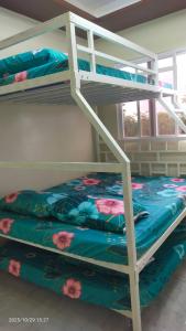 a bunk bed in a room with a bunk bedutenewayangering at J Jireh Residences in San Jose del Monte