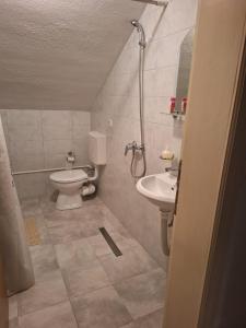 a bathroom with a toilet and a sink at VISOKO Room in Visoko +11 photos