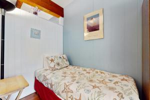 Ένα ή περισσότερα κρεβάτια σε δωμάτιο στο Sandy Toes Escape - Holiday House M6