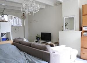 a living room with a couch and a tv at aranjata modern o camera in Cugir in Cugir