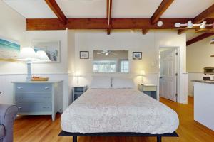 a large bedroom with a bed and a kitchen at Sparkling Sands Holiday House M2 in Moody +17 photos