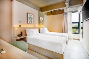 Ένα ή περισσότερα κρεβάτια σε δωμάτιο στο Hotel Attic 33