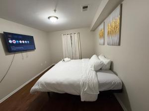 Postel nebo postele na pokoji v ubytování COZY 3 bedroom APT near EWR Downtown NYC + 6 fotografií