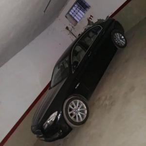 a black car is parked in a garage at Appart Julia Gammarth Sup in La Marsa