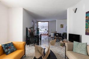 a living room with two couches and a dining room at Villa Luisa Design in Colle Val D'Elsa +41 photos