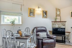 a living room with a chair and a table at 2 Bed in Whitwell oc-o33499 in Whitwell
