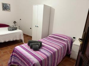 Ένα ή περισσότερα κρεβάτια σε δωμάτιο στο Dal Cappellaio Matto