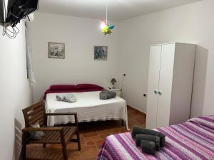 Postel nebo postele na pokoji v ubytování Dal Cappellaio Matto + 5 fotografií