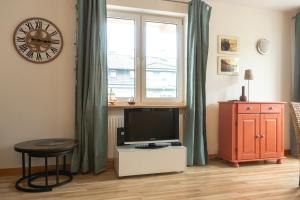 TV a/nebo společenská místnost v ubytování Kotwica i Ośmiornica