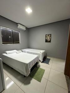 Ένα ή περισσότερα κρεβάτια σε δωμάτιο στο Varandas Hotel +1 φωτογραφίες