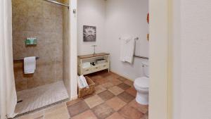a bathroom with a toilet and a shower at LV026 Secluded Downstairs Legacy Villas Studio in La Quinta
