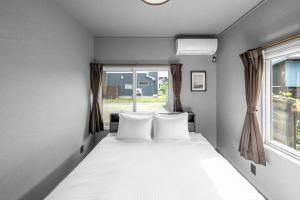 Postel nebo postele na pokoji v ubytování SNOWGARDEN YIG STAY - Vacation STAY 65492v